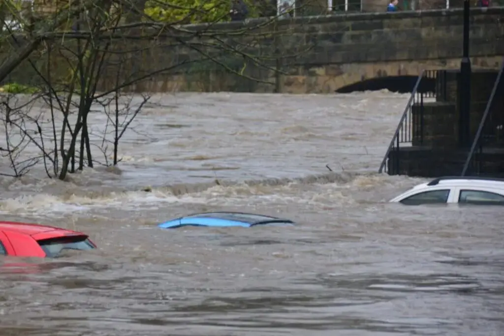 Submerged cars in flooded Dover street