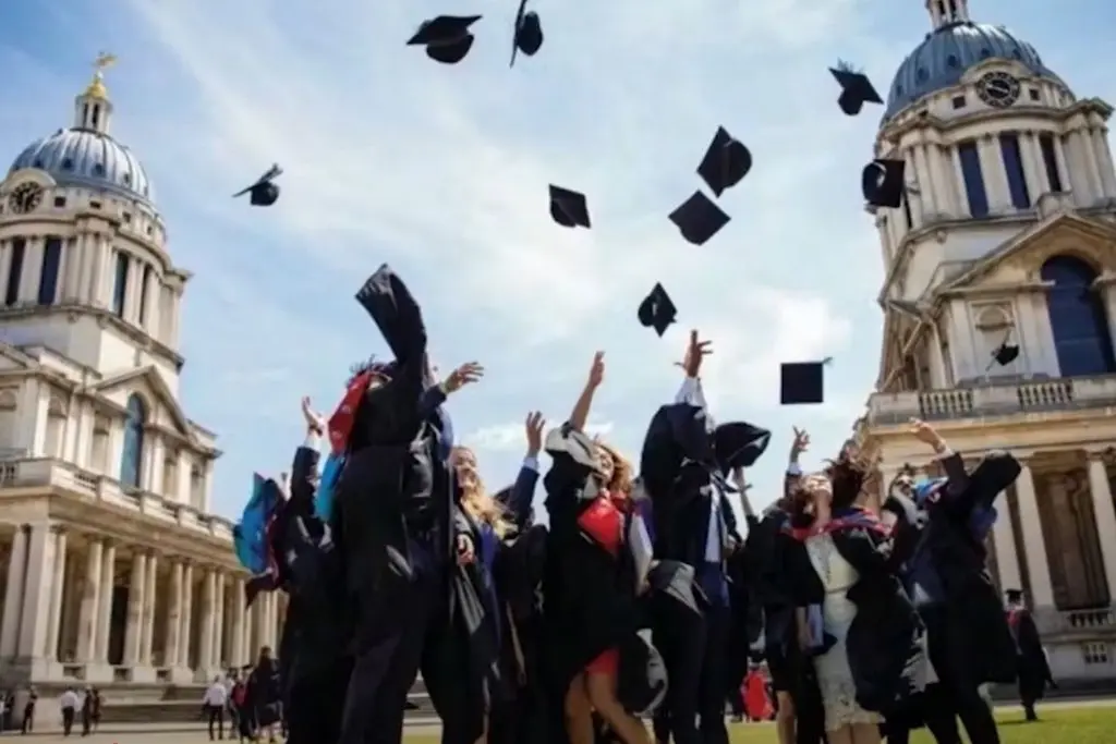Students throwing graduation caps in the air to celebrate the event