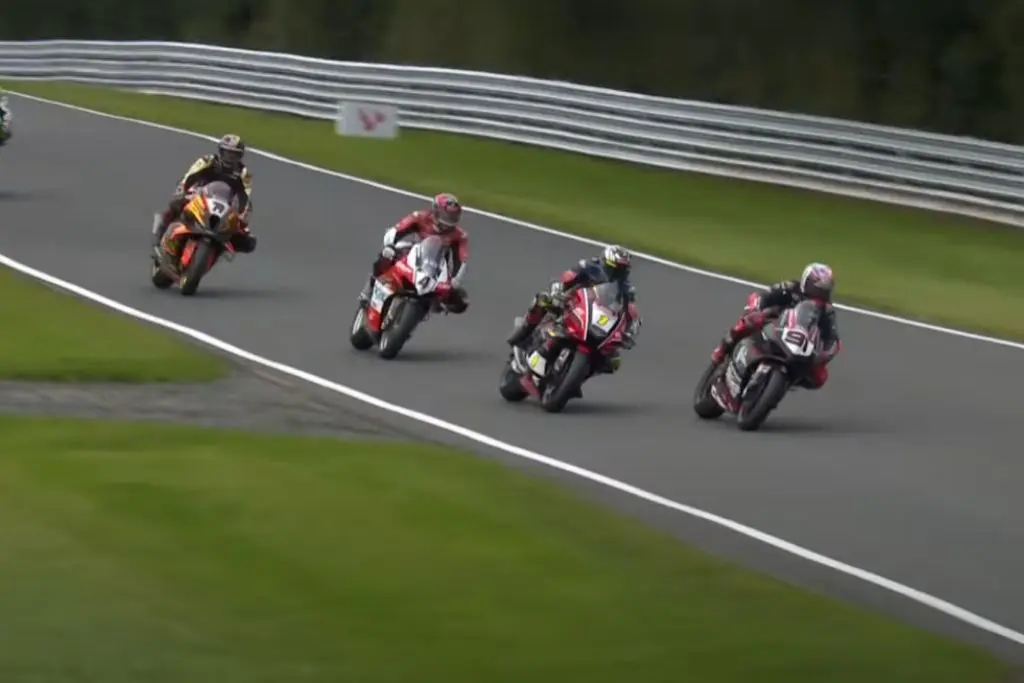 Motorbikes Racing Wheel-to-Wheel on Track